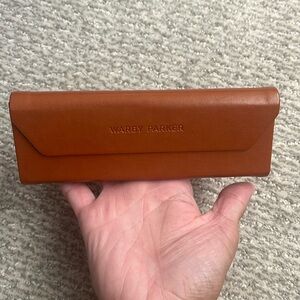 Warby Parker magnetic, collapsible glasses case.